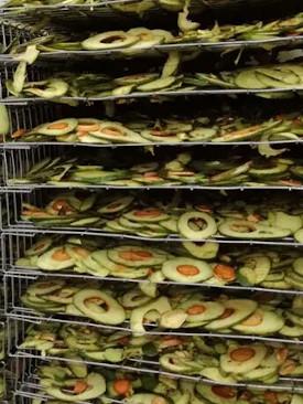The whole avocado fruit is washed, sliced and left to dry.